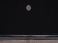 black Phulia saree with floral motifs
